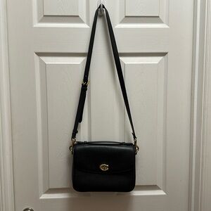 Coach black crossbody bag. Worn, in great condition. Gold hardware.